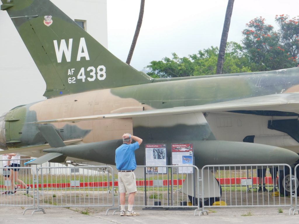 Tom checking one of the air planes next to the Pacific Aviation Museum