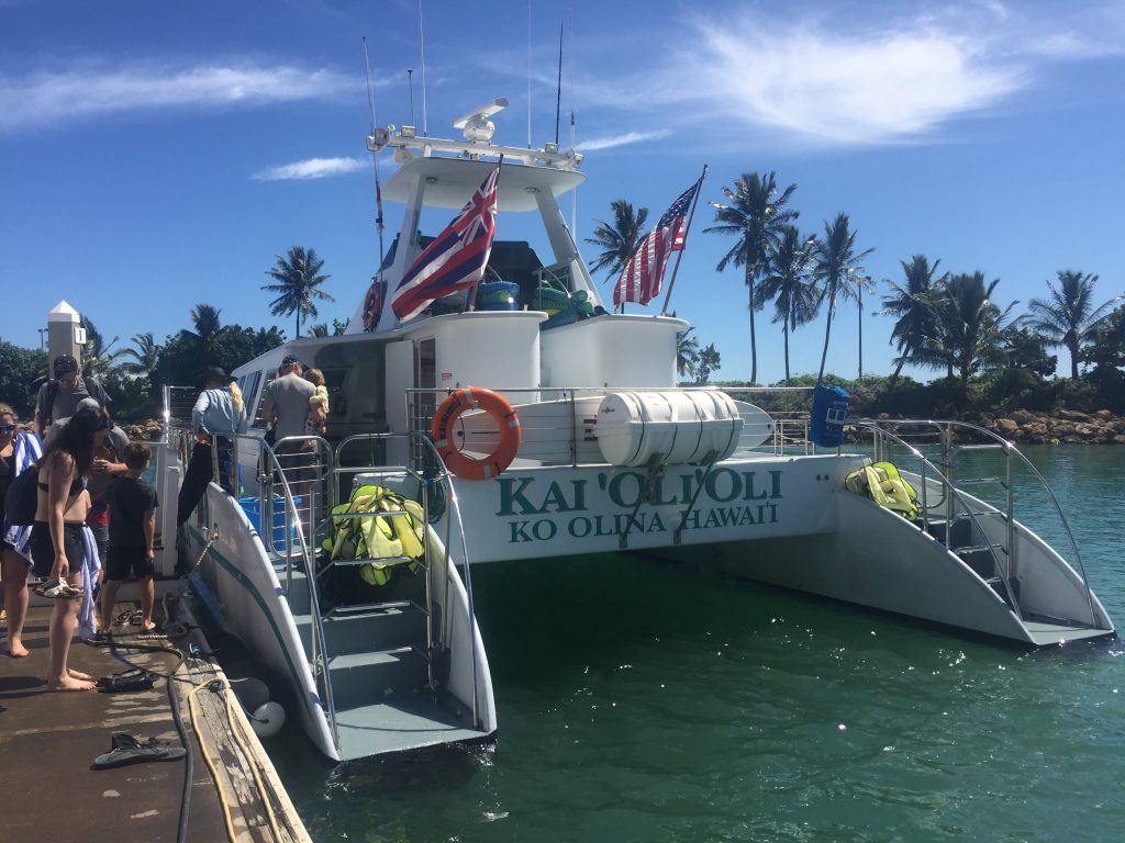 Boarding the Kai'Oli'Oli catamaran to go snorkeling on Oahu. 