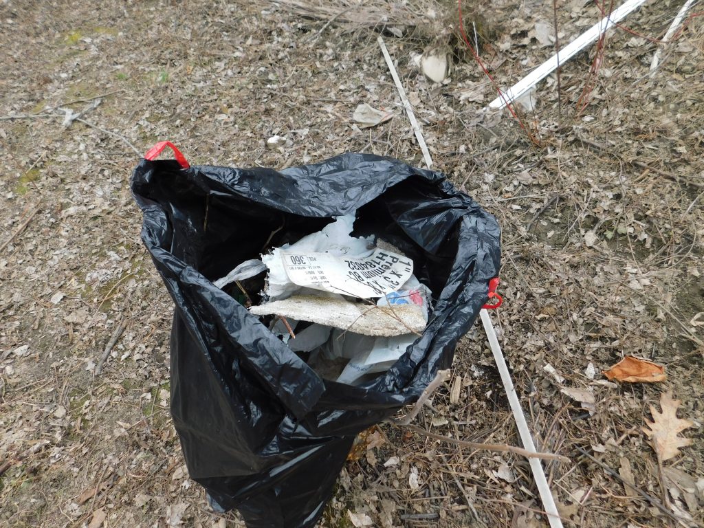 Big garbage bag filled with trash from our Earth Day clean up. 