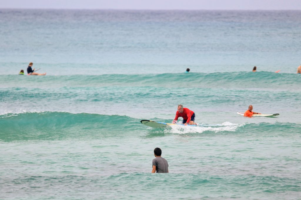 Tom at surf board at Waikiki Beach