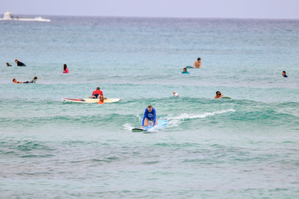 Karen on surf board at Waikiki beach