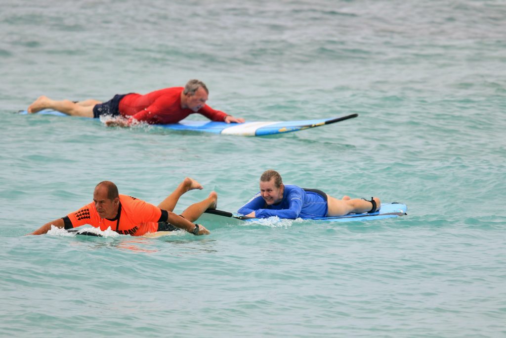 Karen, Tom and their surfing teacher during her first MS challenge