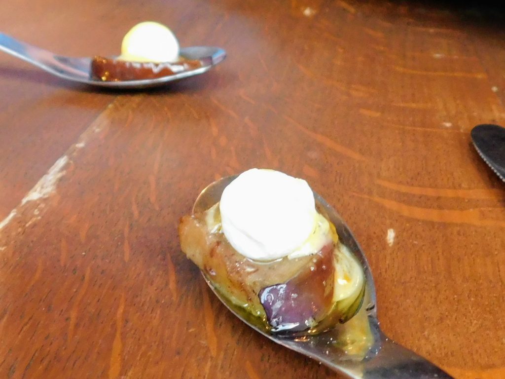 Two spoons with eggplant and crème fraîche. Wonderful way to start our meal in this Bib Gourmand restaurant in Paris