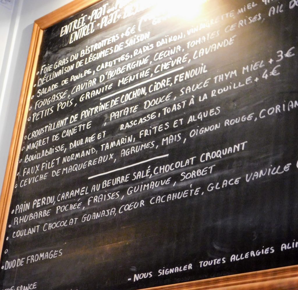 Picture of the hand written menu on the wall of this Bib Gourmand restaurant in Paris