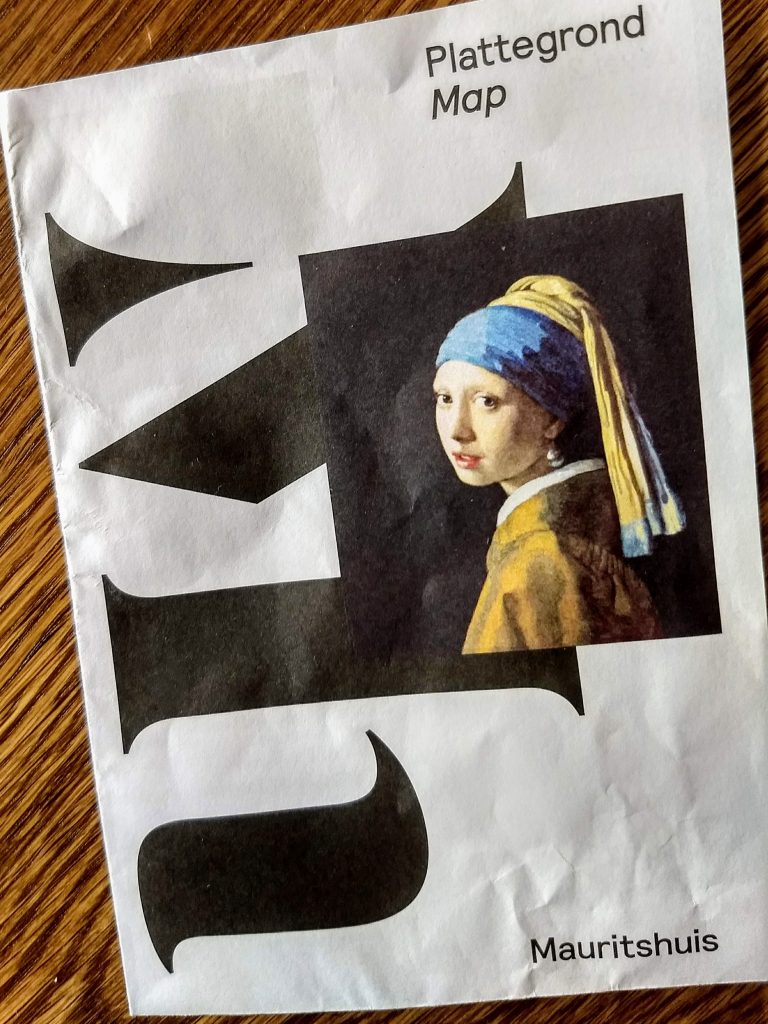 Front of the Mauritshuis brochure, showing The Girl with the Pearl Earring. Another masterwork in the same museum where you can find The Goldfinch painting