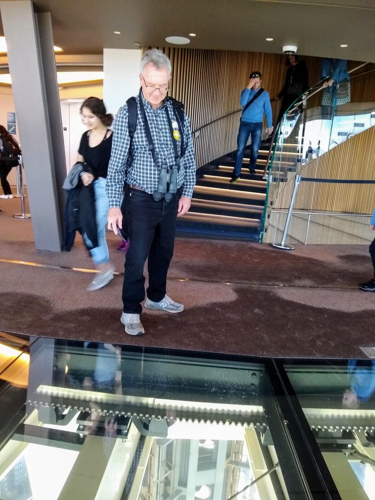 Tom admiring the view through the floor. 