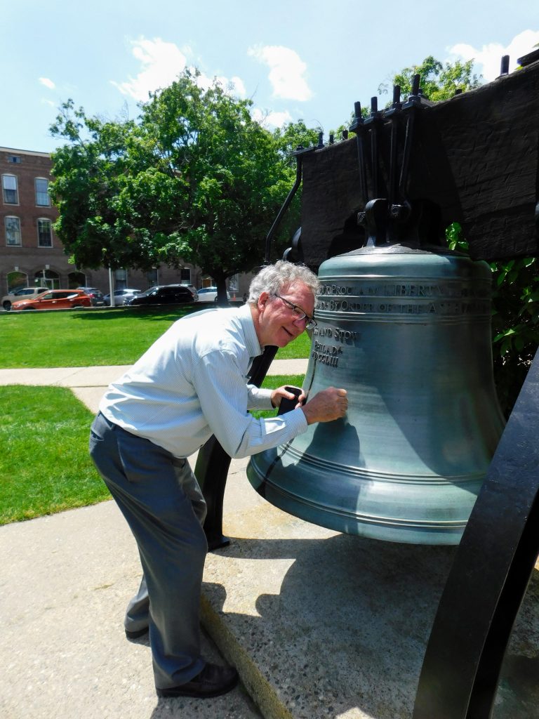 Tom listening to the Liberty Bell Replica