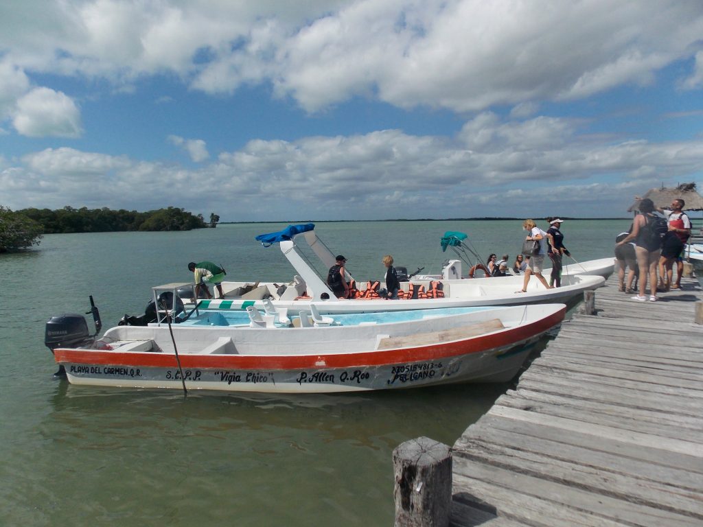 Two boats anchored at the dock