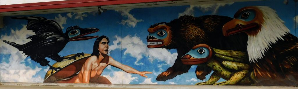 Mural in Juneau, Alaska. Native American with raven, bear, frog and eagle
