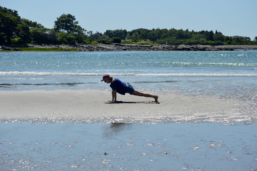 Karen planking on Goose Rocks Beach in Maine. Getting stronger by doing exercises for her MS 