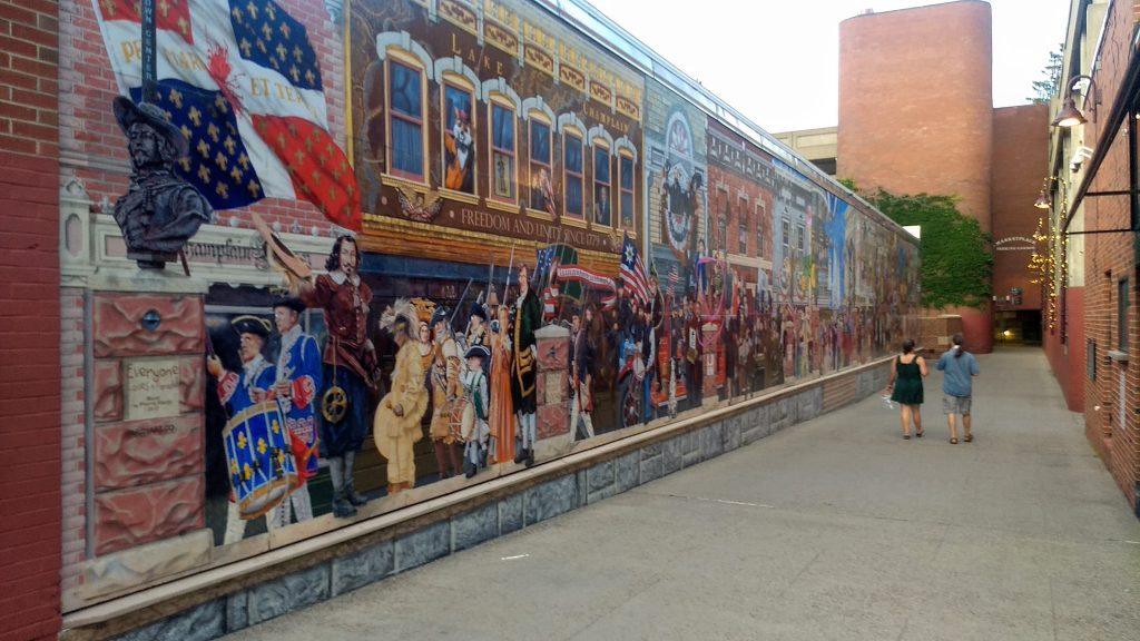 Colorful mural in Burlington with lots of historical Vermont people.