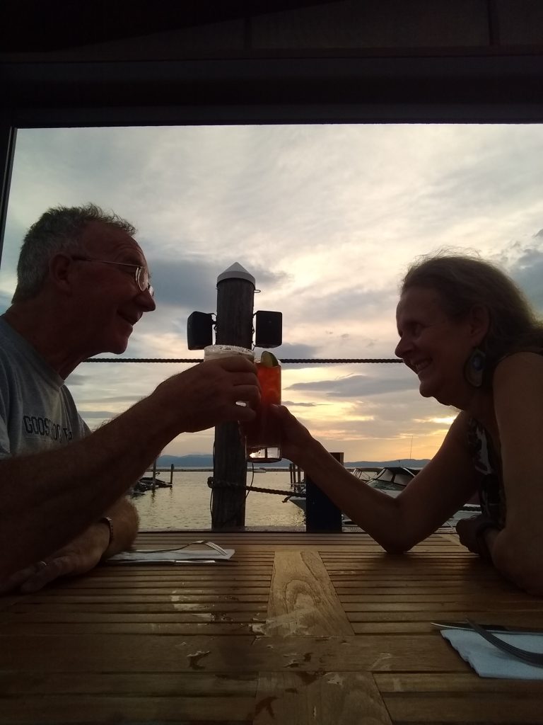 Tom and Karen toasting with Lake Champlain,Vermont in the background