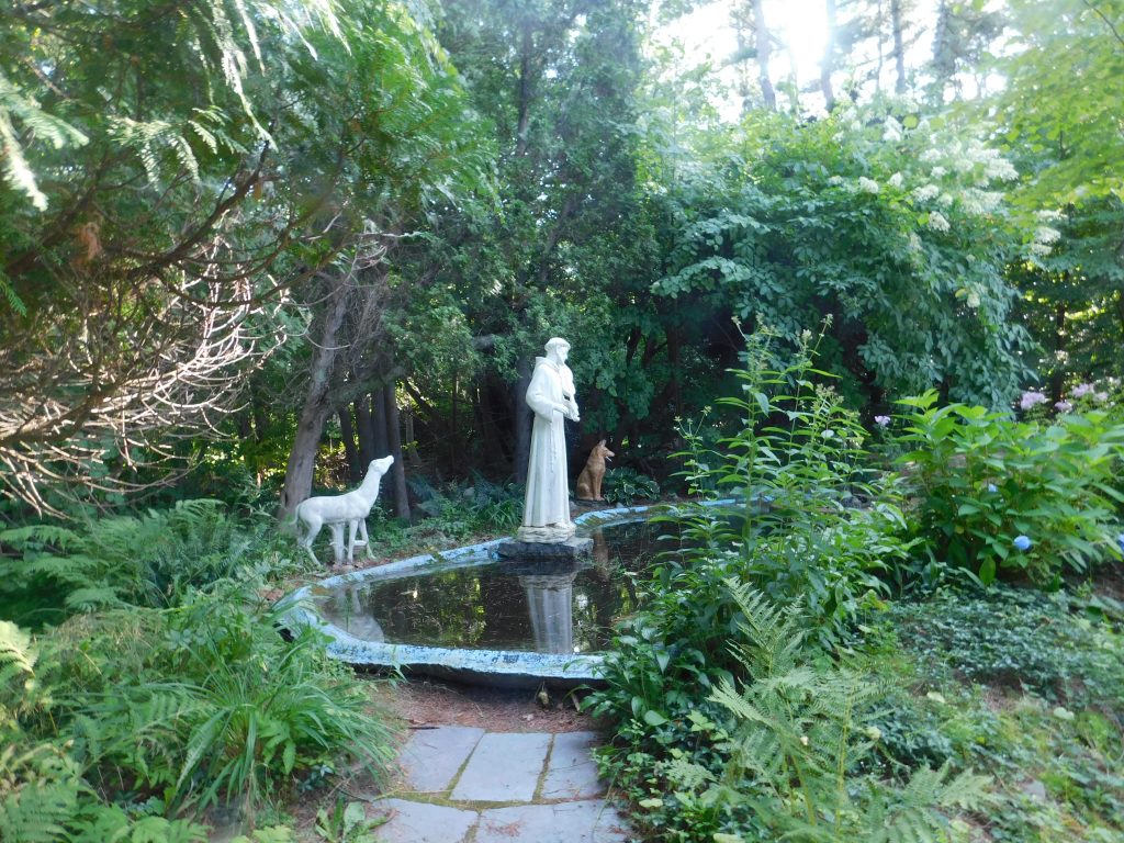 Saintly statue overlooking a small point. 