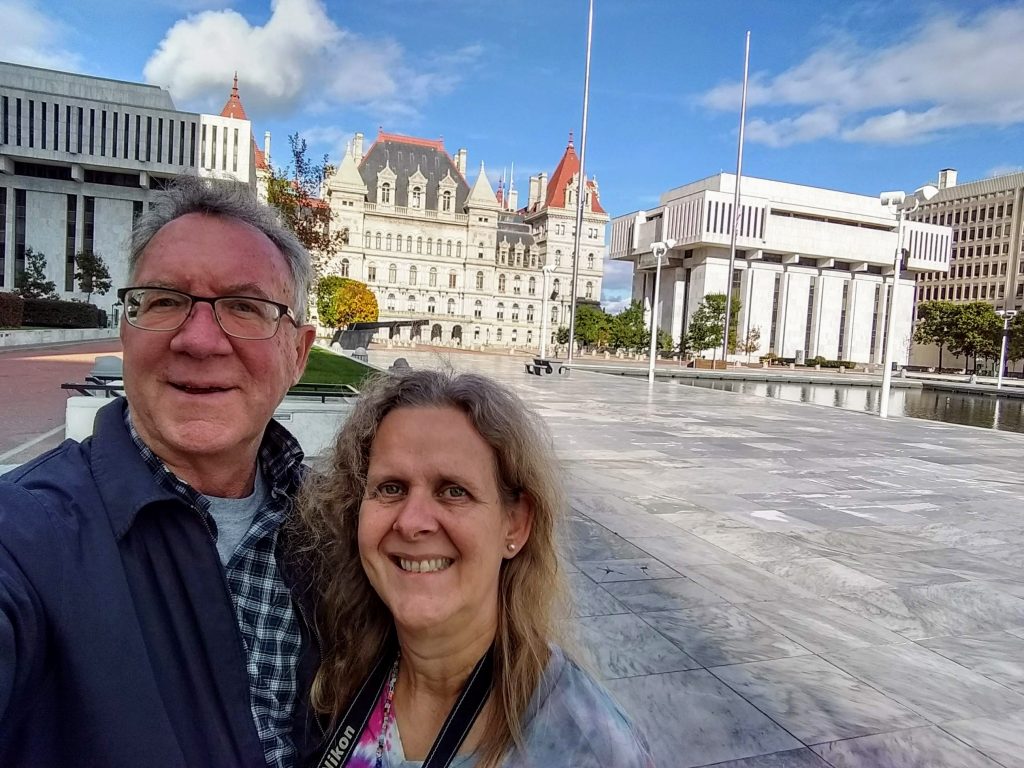 OurCarpeDiem selfie with the New York State Capitol in the background. 