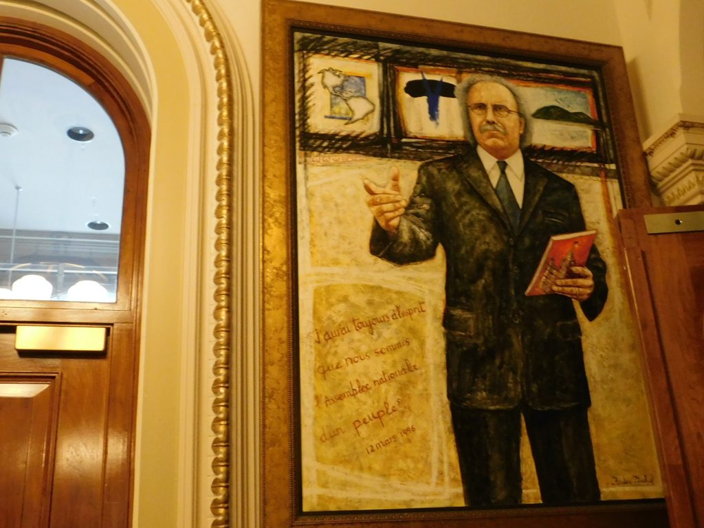 Painting of a gentleman holding a book in the Quebec National Assembly