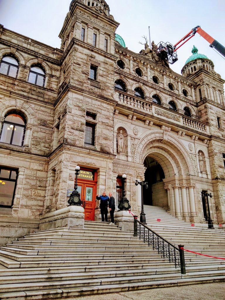 Front view British Columbia Parliament building with Main Entrance (small) next to Ceremonial Entrance (big)