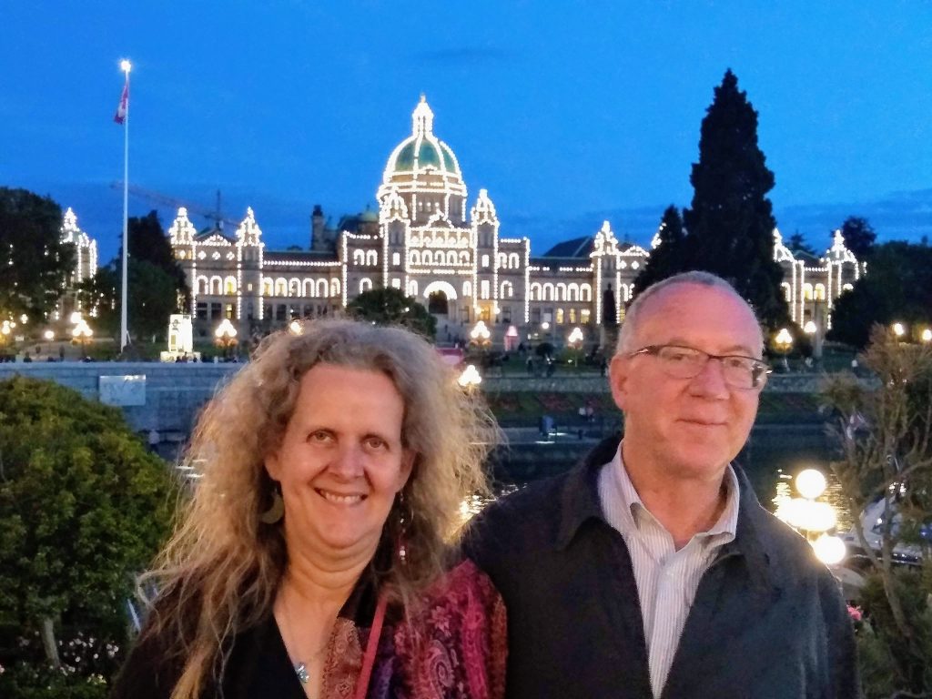 Karen and Tom with B.C. Parliament Building in background. 