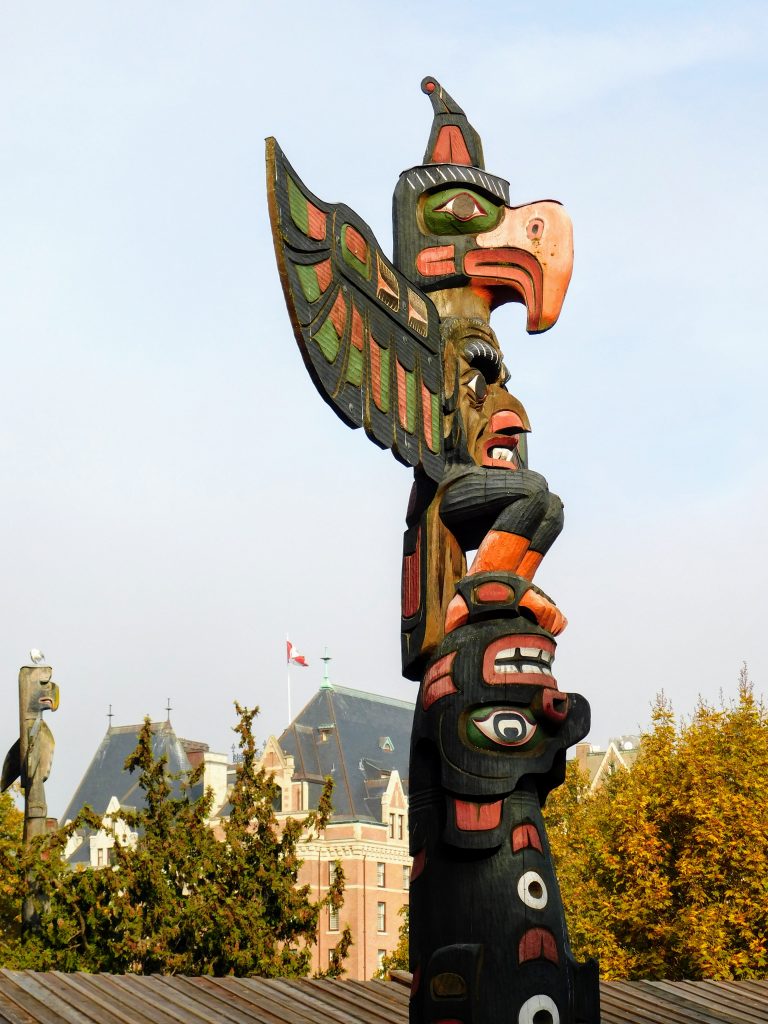 Beautifully carved totem pole in Victoria BC