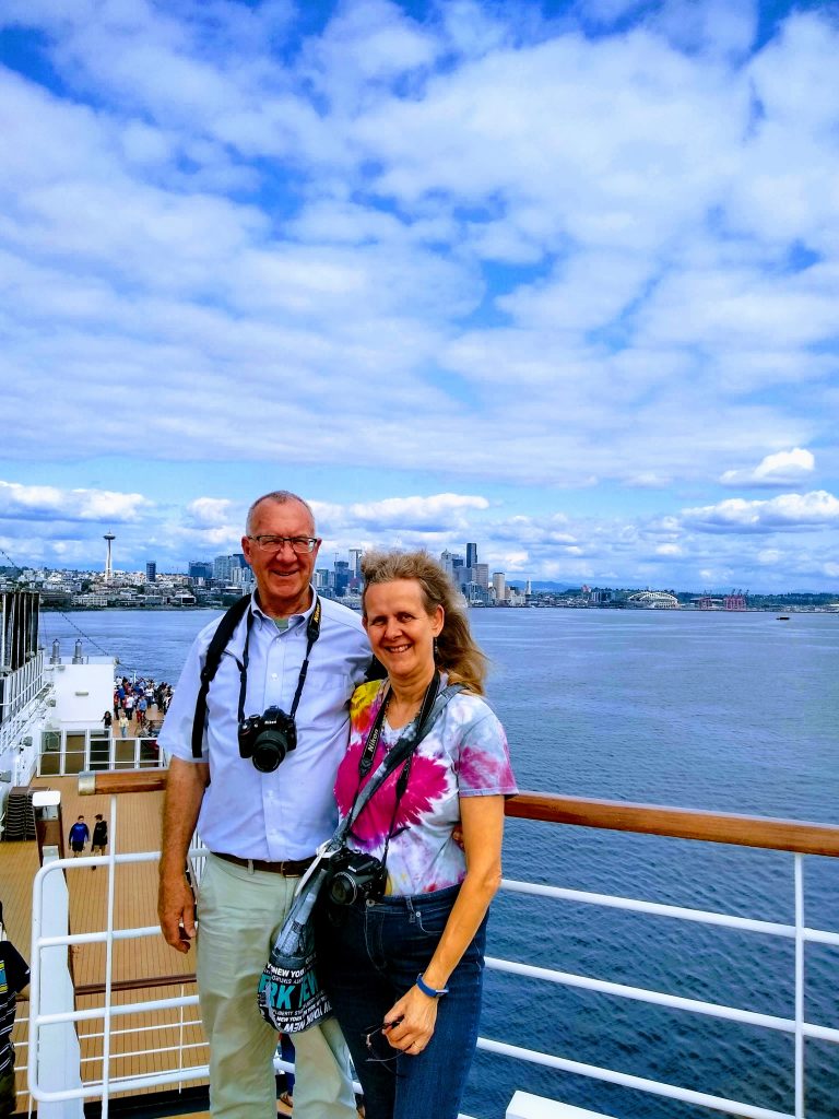 Tom and Karen on Eurodam leaving Seattle on their Alaska Cruise
Seattle sky line and Puget Sound behind them. 