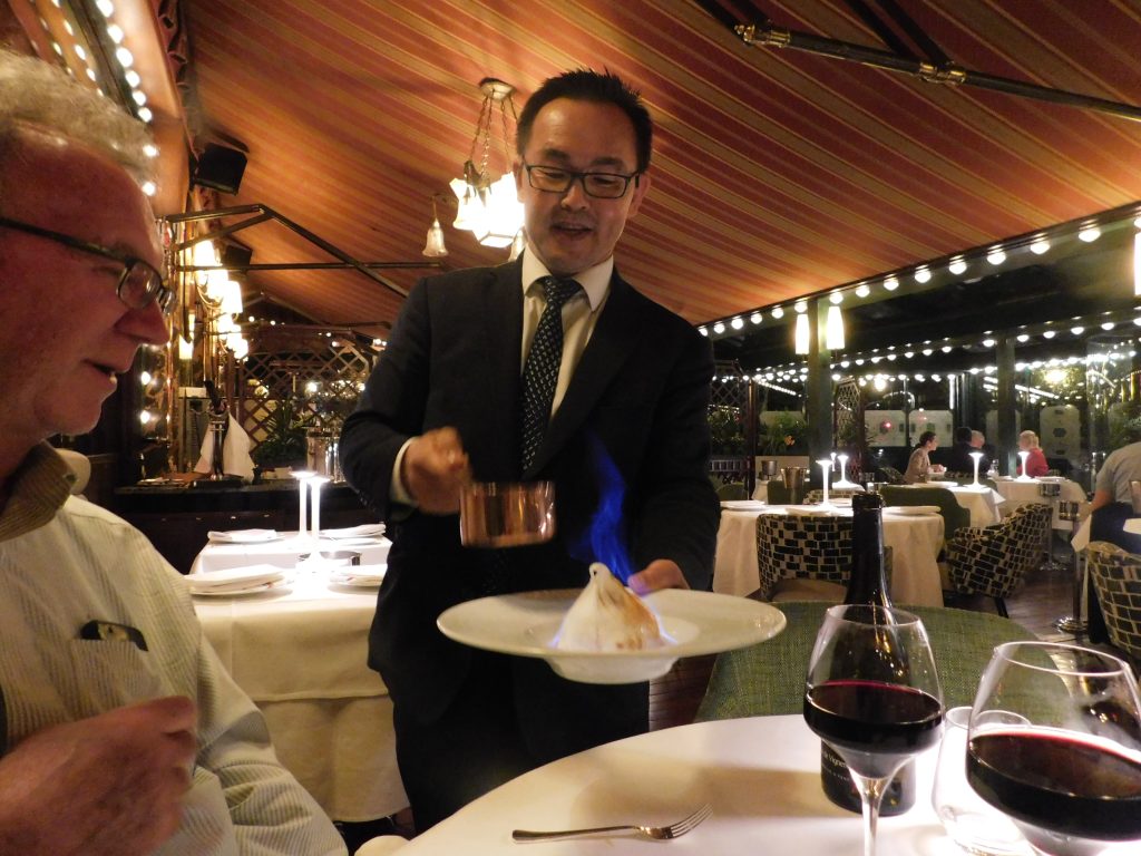 Baked Alaska served in a fiery presentation at La Closerie des Lilas