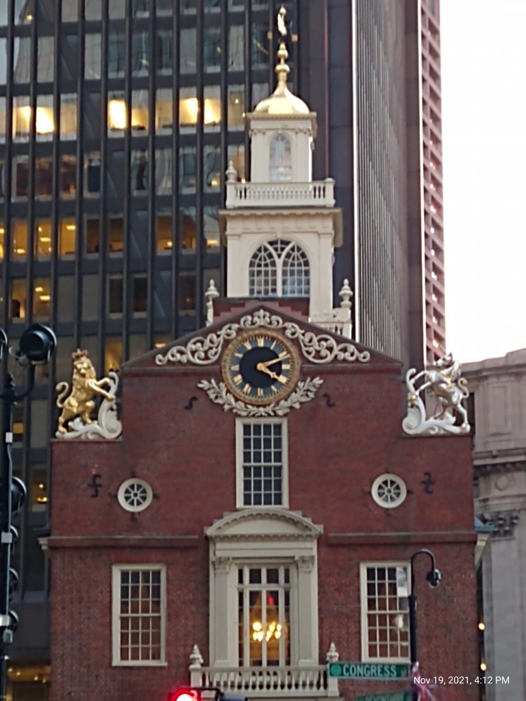 Old State House Boston, dwarfed by skyscrapers all around it. 