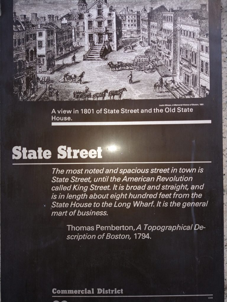 A view in 1801 of State Street and the Old State House.

State Street is the most noted and spacious street in town, and was called King Street until the American Revolution. It is broad and straight and is in length about 800 feet from the State House to the Long Wharf. If is the general mart of business. 

Thomas Pemberton, A Topographical Description of Boston, 1794