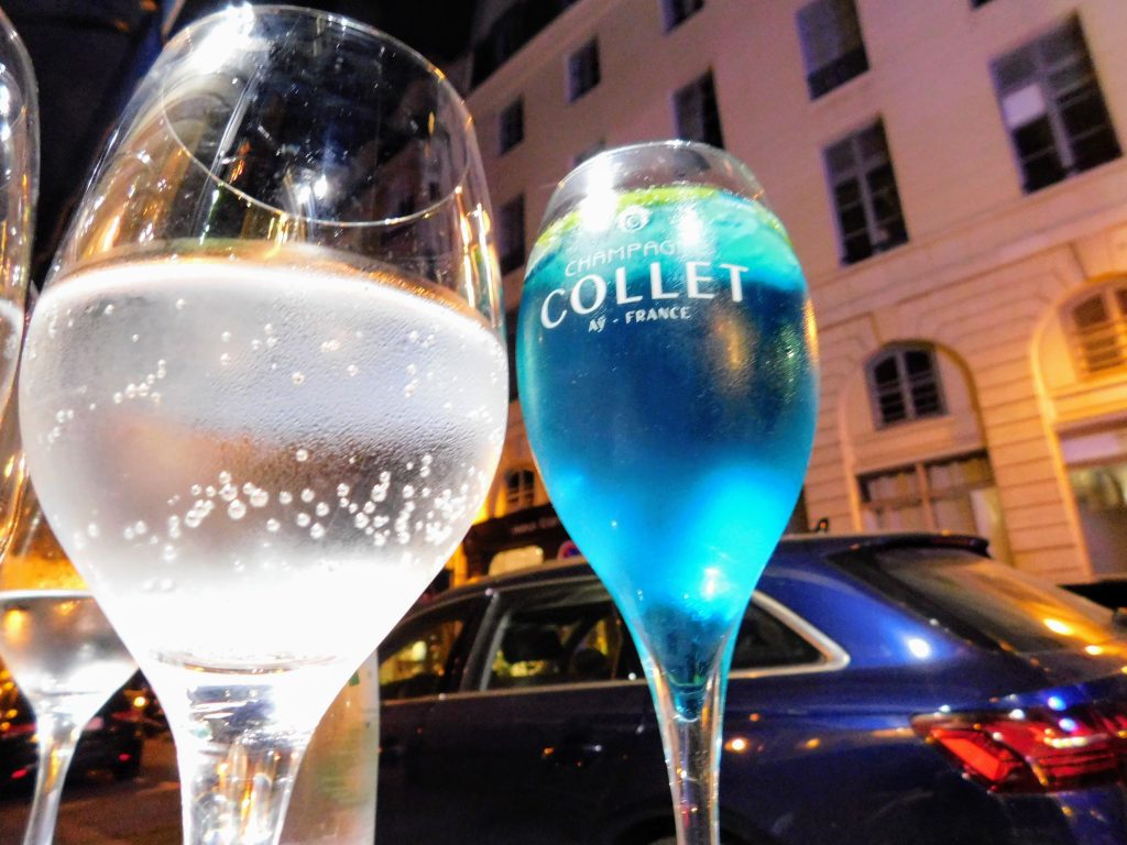 Two drinks, one with clear bubbles, one blue