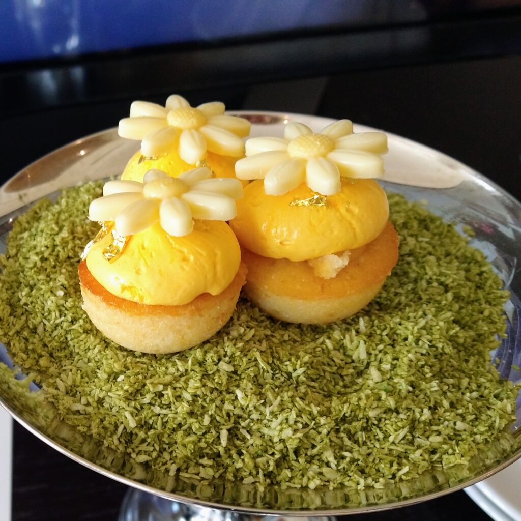 Tasty welcome snack, pastry with flowers on top at the Waldorf Astoria Amsterdam