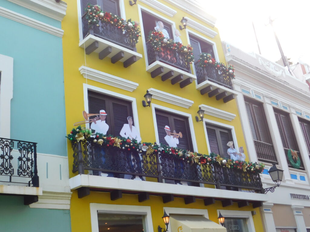 Colorful house in Puerto Rico with Cutout jazz players on the balcony
