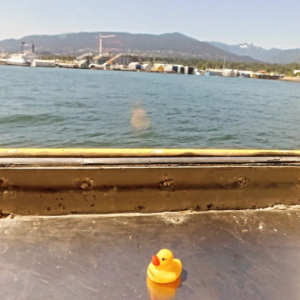 Kwek on a ferry out of Vancouver. Flat Stanley travel photos