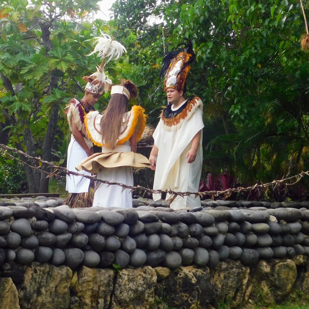 Three Polynesian people talking together