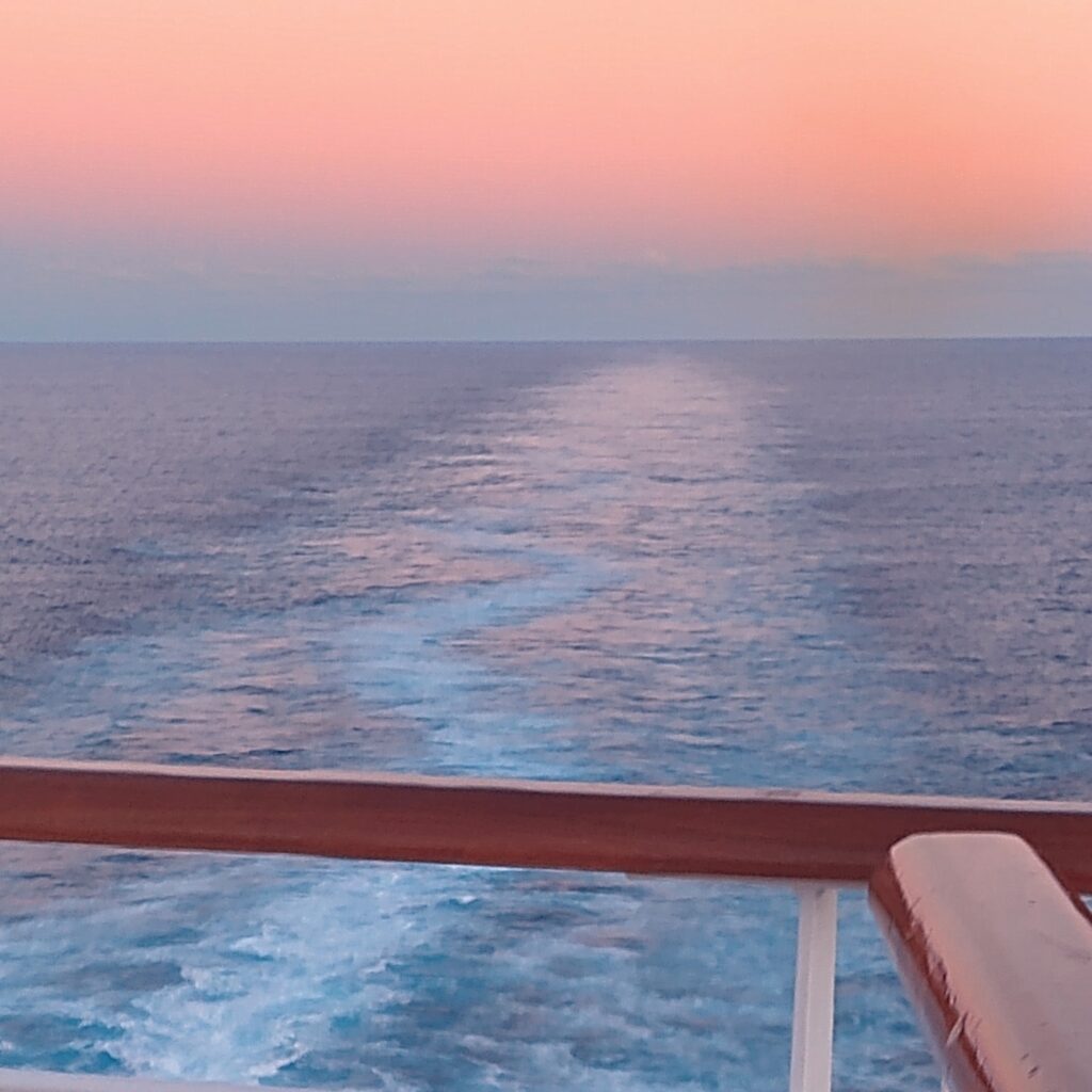 wake of a cruise ship during sunset