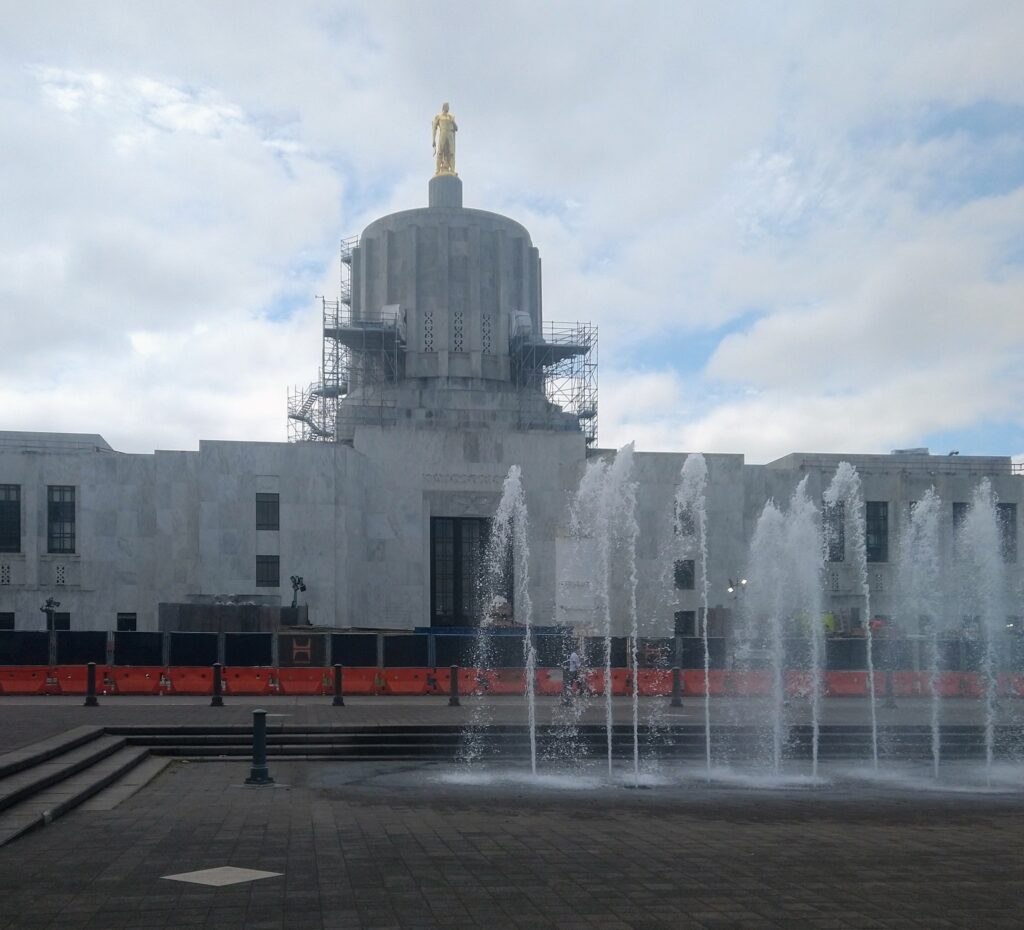 Oregon State Capitol with fountains in foreground